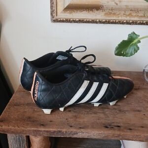 Adidas Black and White Soccer Cleats with Orange Accents
